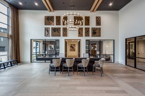 A dining room with a table set for six.