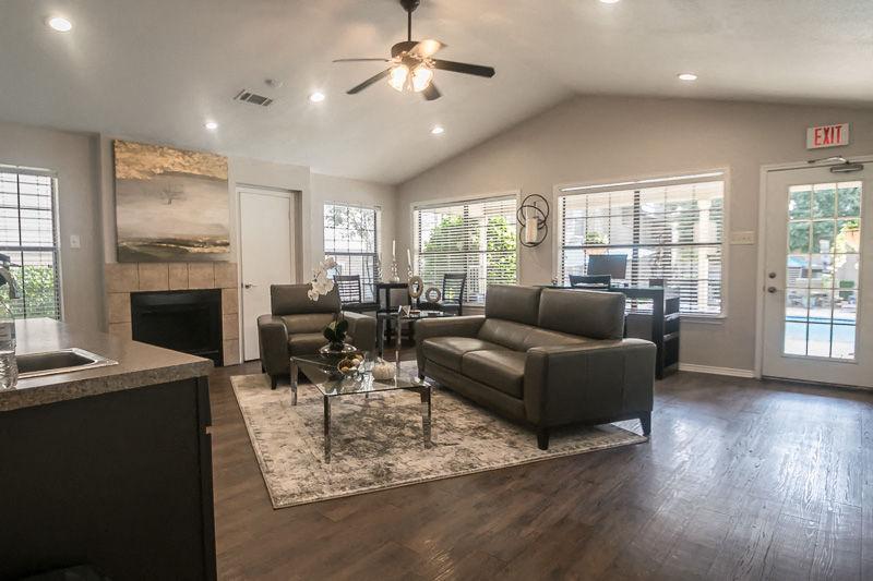 the view of a living room with couches and a table