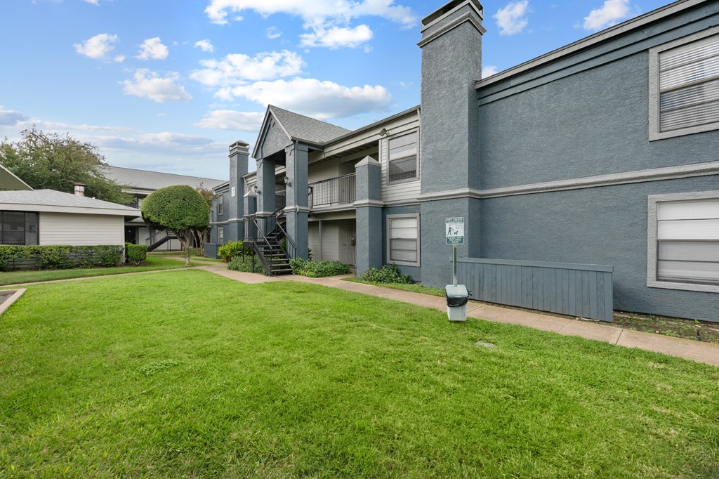 our apartments are located in a quiet neighborhood with a green lawn