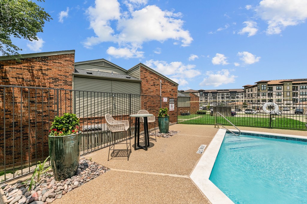 our apartments offer a swimming pool at The Hills at Ironhorse, North Richland Hills, TX