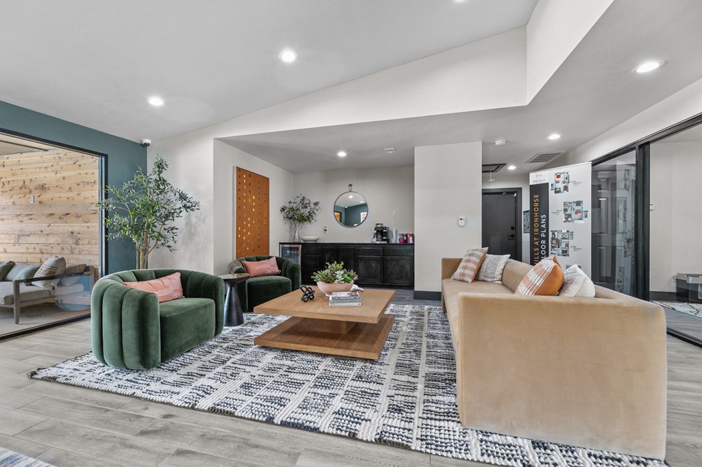 a living room filled with furniture and a large window at The Hills at Ironhorse, North Richland Hills
