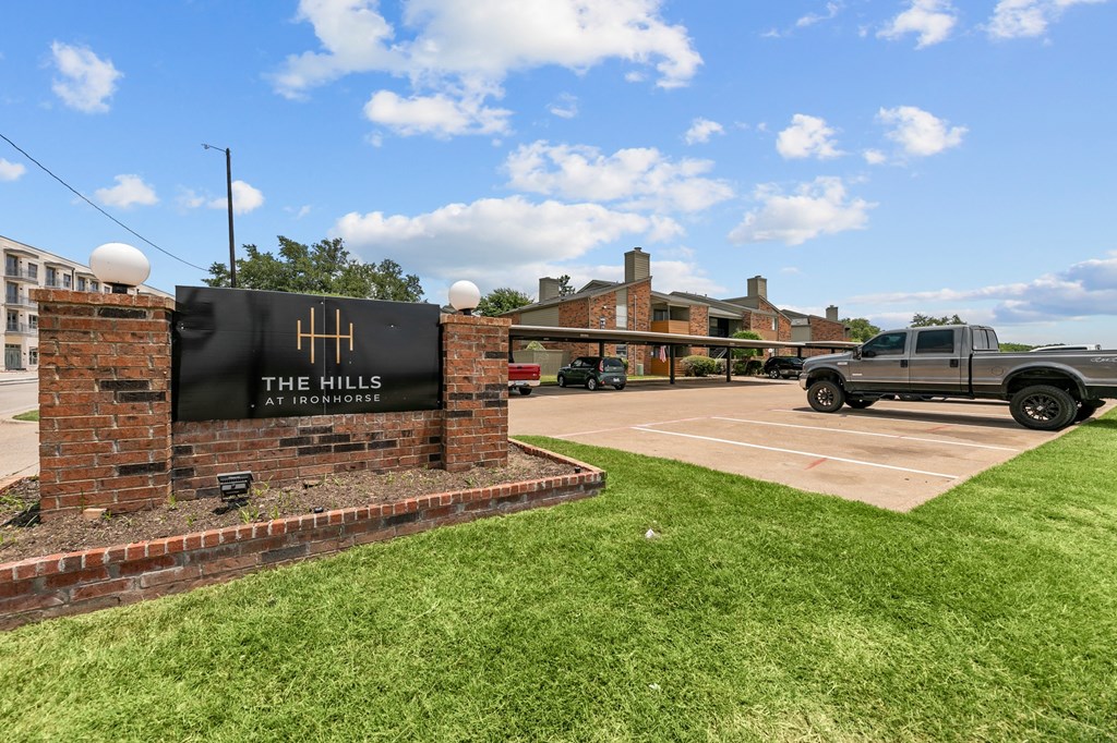 a truck parked in a parking lot in front of a building at The Hills at Ironhorse, Texas