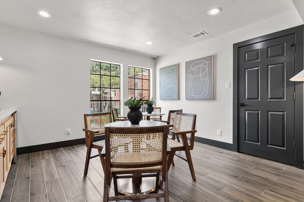 a dining room with a table and chairs at The Hudson, North Richland Hills, Texas