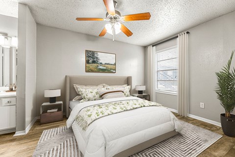 a bedroom with a bed and a ceiling fan at 5636 Apartment Homes, Dallas, TX