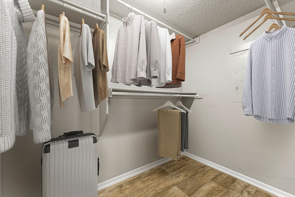 the preserve at ballantyne commons closet with robes and clothes hanging on a rack