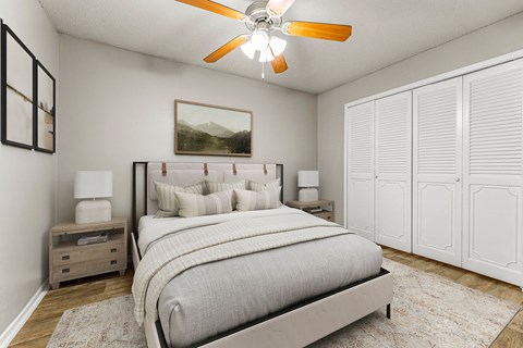 a bedroom with a bed and a ceiling fan at 5636 Apartment Homes, Dallas, TX