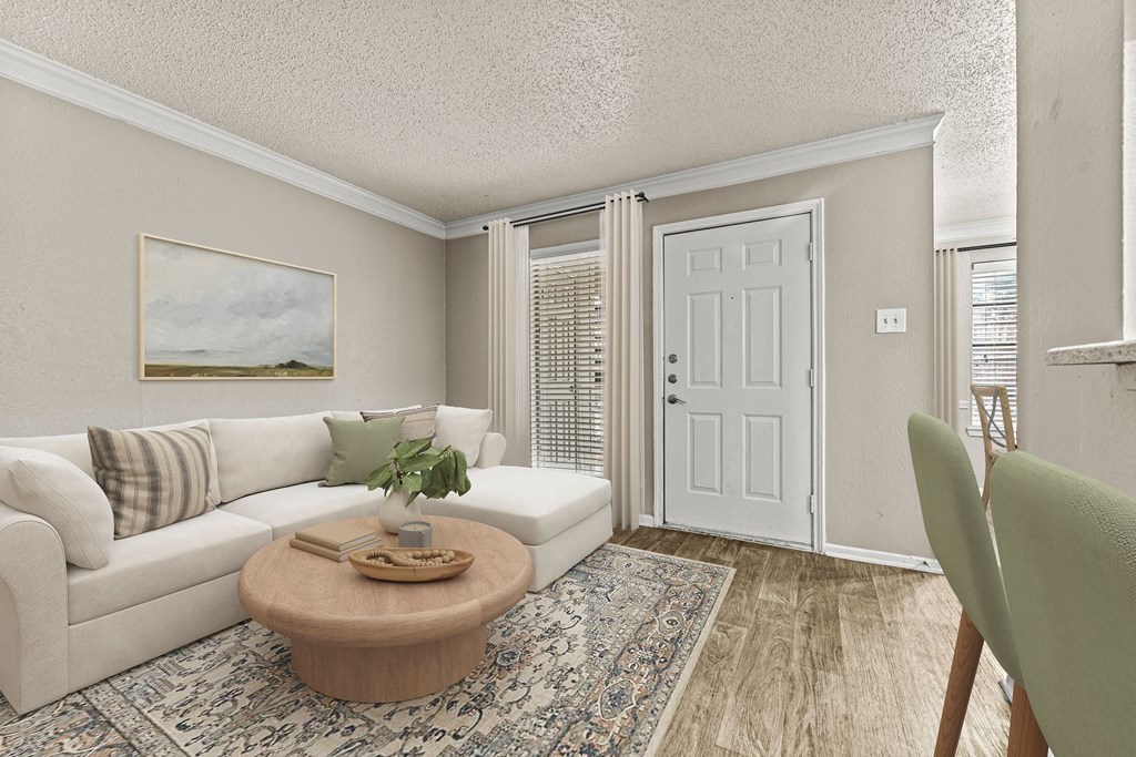 an open living room with a white couch and a table