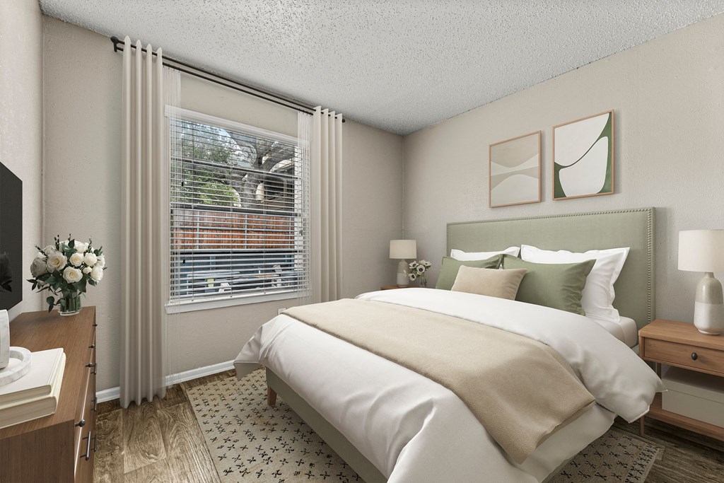 a bedroom with a large bed and a window