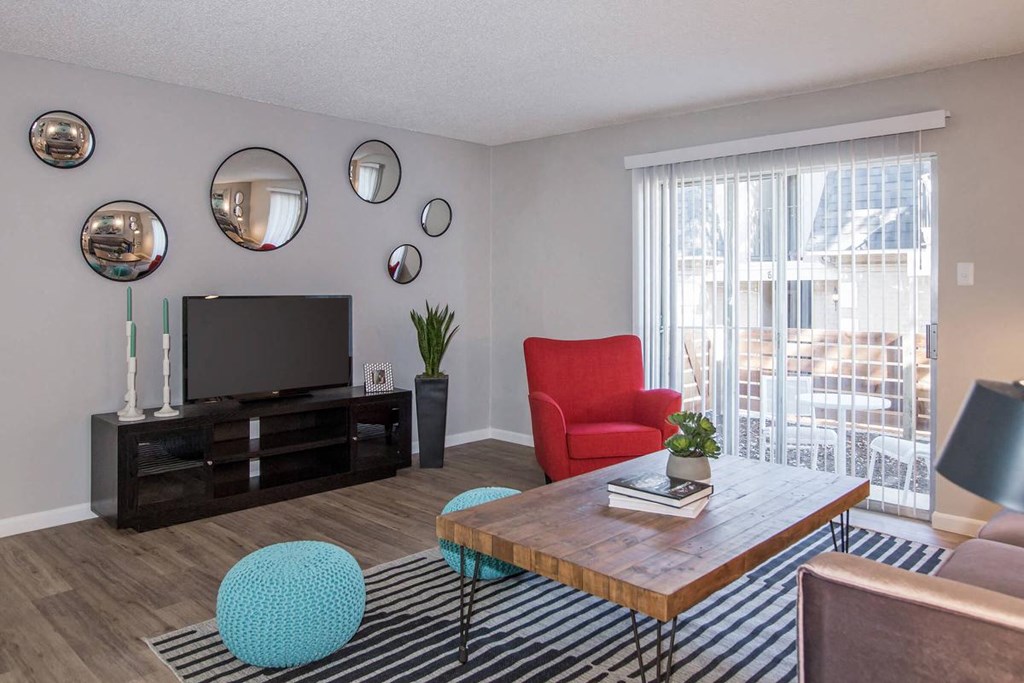 a living room with a television and a table