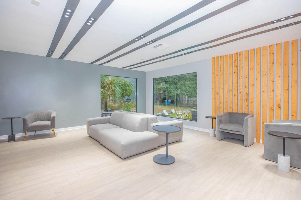 a living room with a couch and two chairs