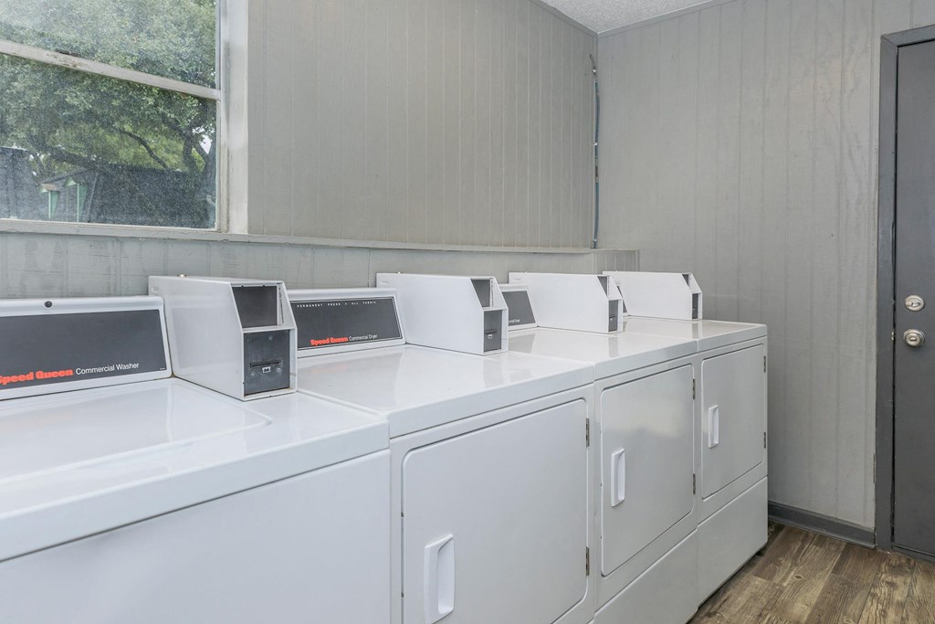 the laundry room is equipped with washes and dryers and has a window