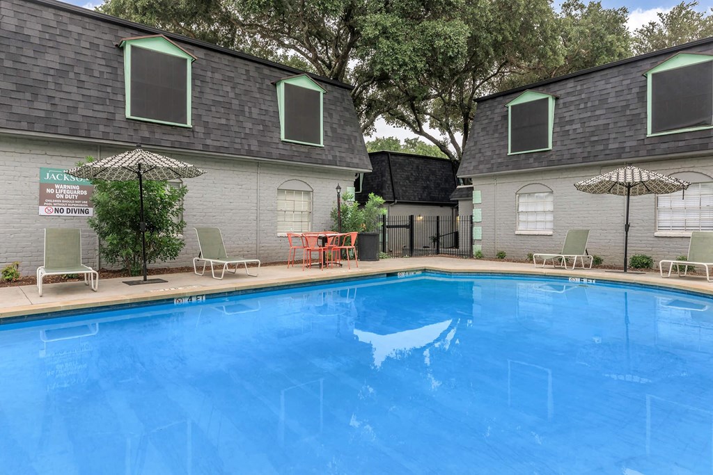 the pool is in front of the house