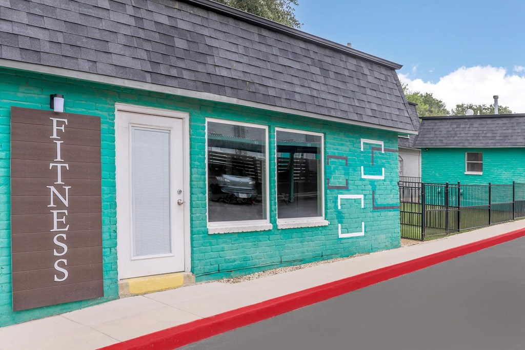 the front of a building with a car in the window