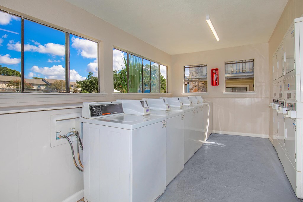 the laundry room is equipped with washers and dryers