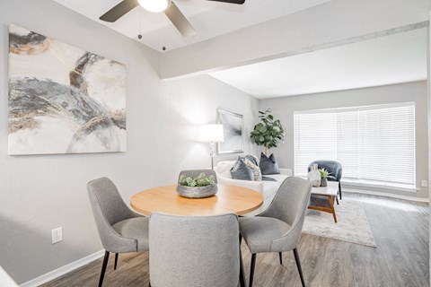 our apartments offer a dining room and living room with a large window at Aero White Rock, Dallas, TX