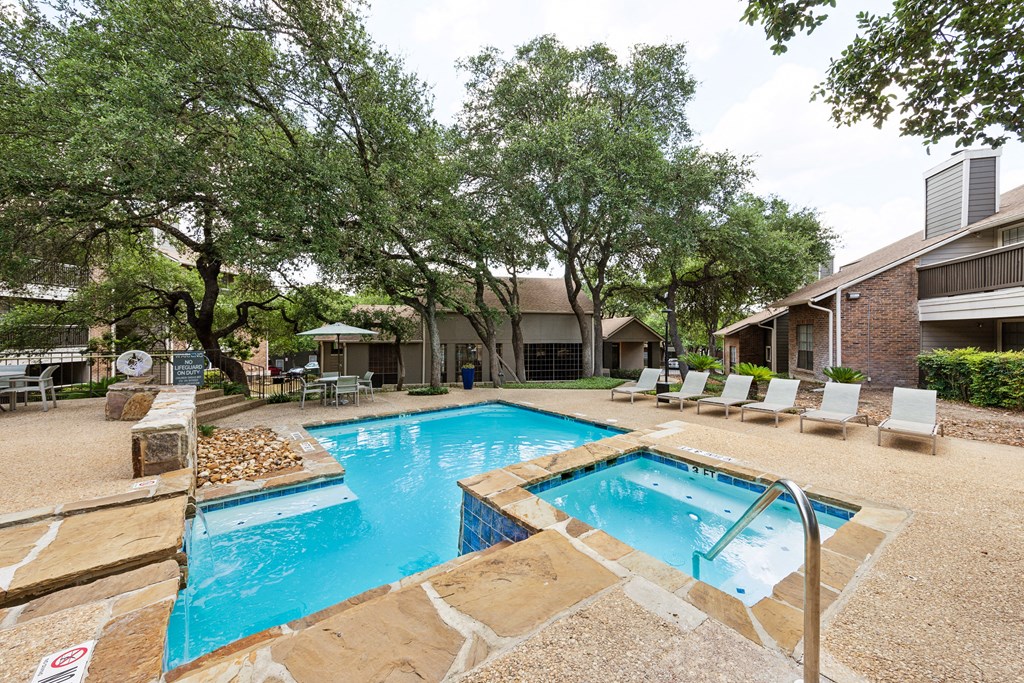 our apartments have a swimming pool and a patio with chairs