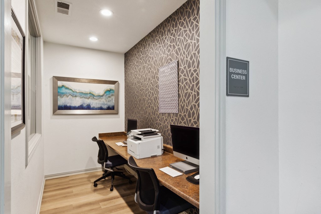 Our resident business center with two desks and a computer