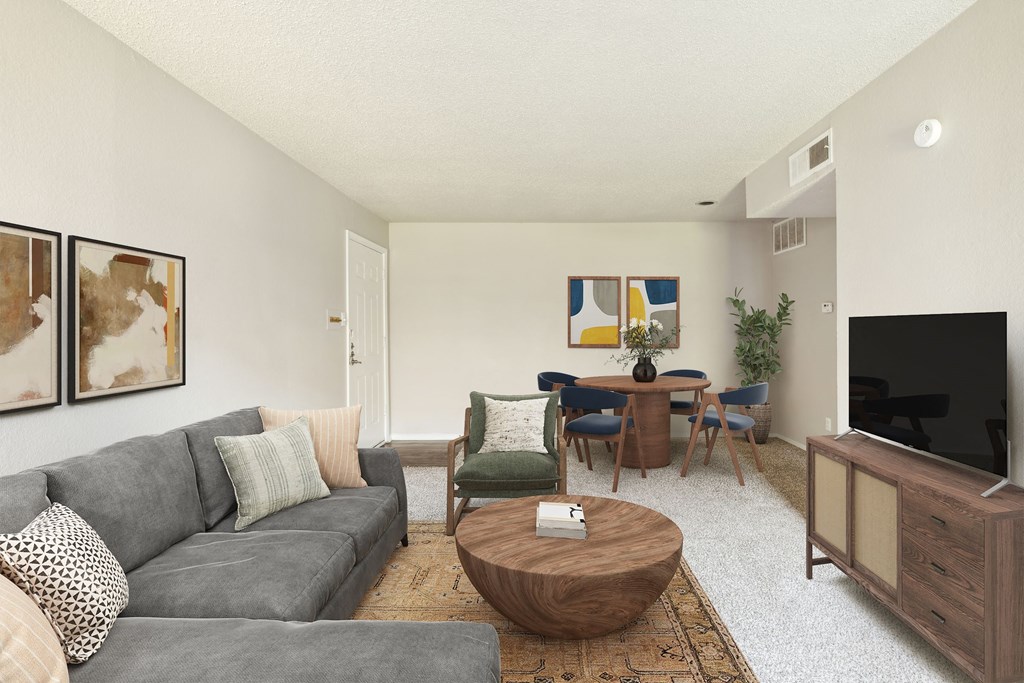 Living room with couch and tv at The Hamptons, Dallas, Texas