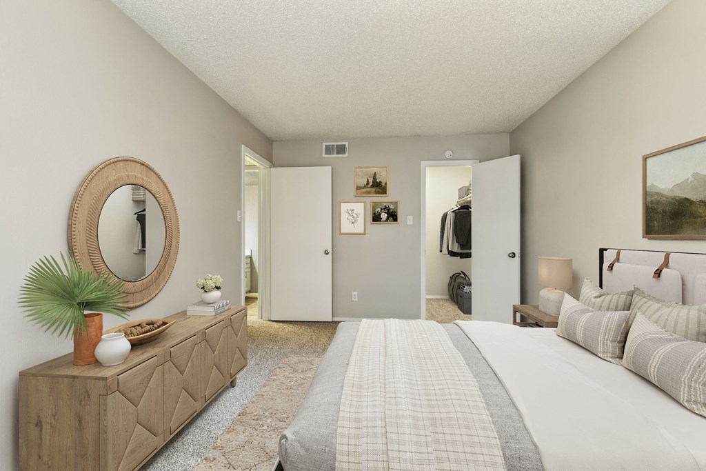 Bedroom with a large bed and a mirror at The Hamptons, Dallas, TX 75287