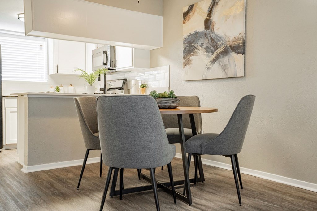 a dining room with a table and chairs at Aero White Rock, Dallas