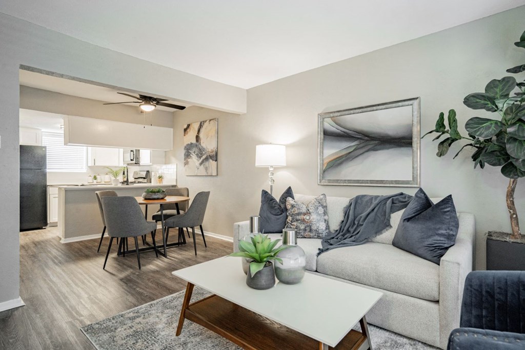 a living room with a couch and a table at Aero White Rock, Dallas, TX