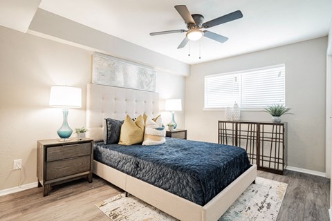 a bedroom with a bed and a ceiling fan at Aero White Rock, Dallas, Texas