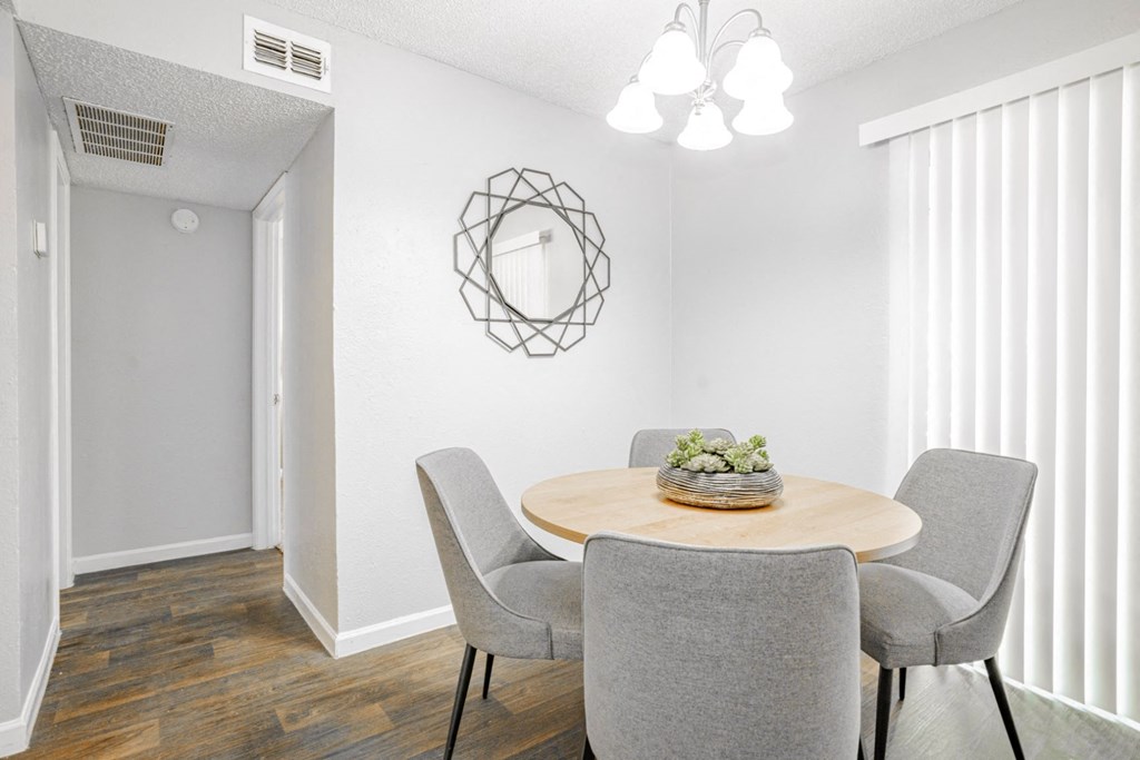 our apartments offer a dining room with a table and chairs