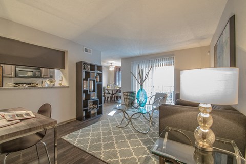 our apartments offer a living room and dining room with a table and chairs