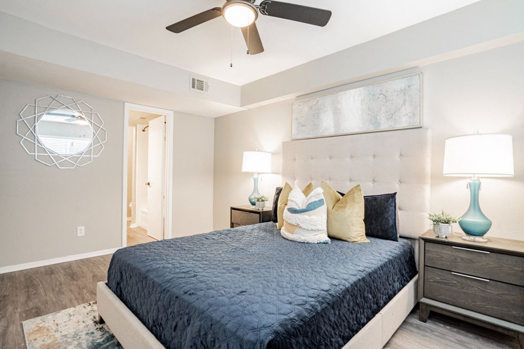 a bedroom with a bed and a ceiling fan at Aero White Rock, Dallas, 75238