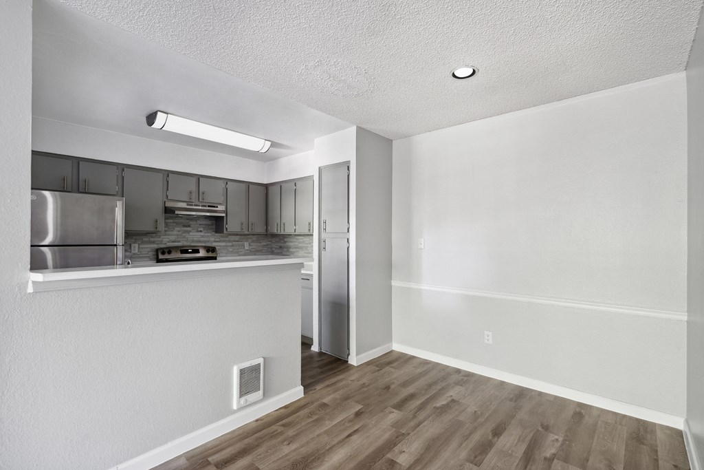 the living room and kitchen of our studio apartment at university towers