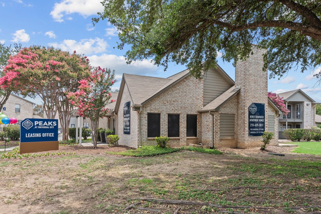 a home with a leasing sign in front of it