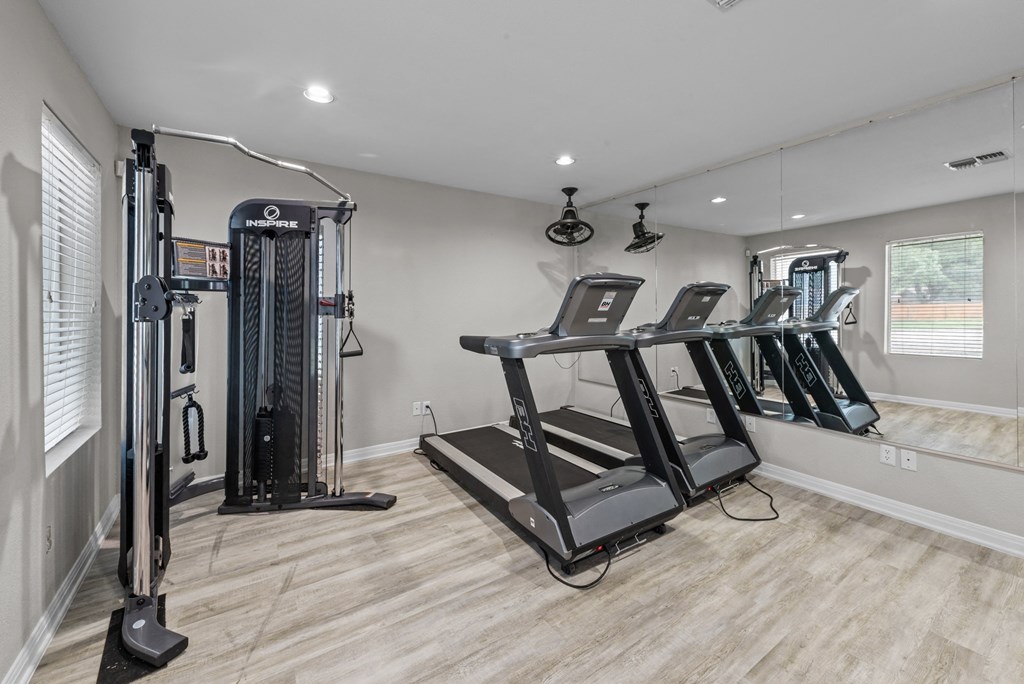 the gym at the whispering winds apartments in pearland, tx