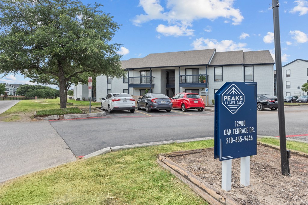 a sign in front of a building