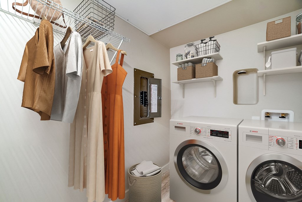 a washer and dryer in a laundry room at The Frederick, San Antonio Texas
