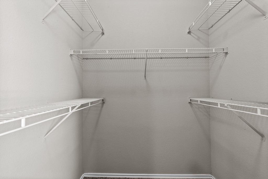 Empty white shelves in a room.