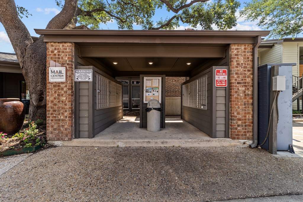 A mail center with a sign on the wall.