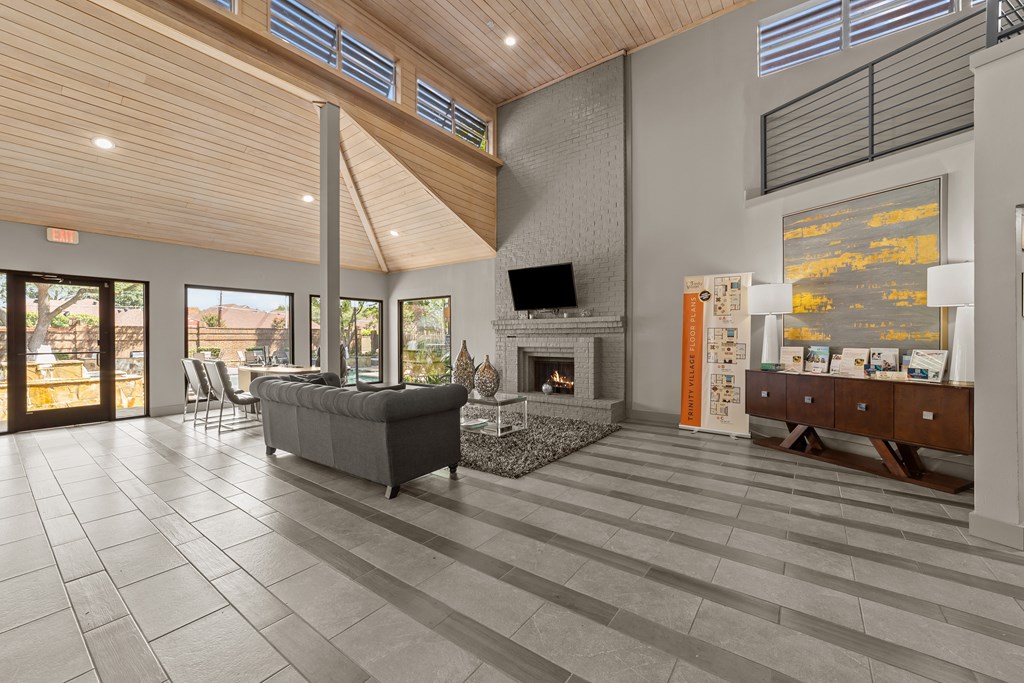 A modern living room with a fireplace and a television.