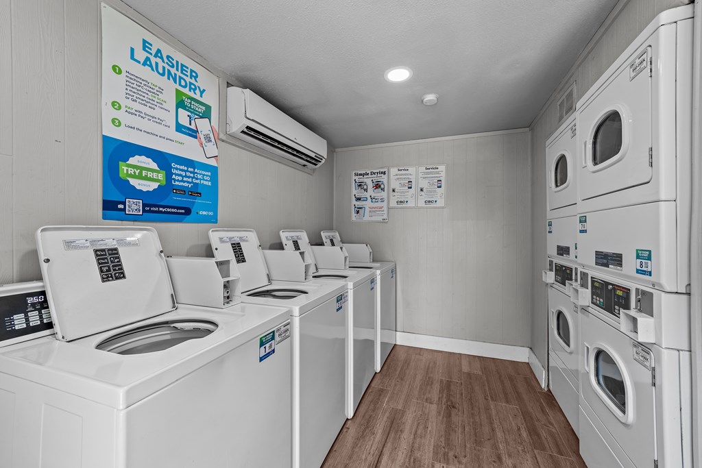 A row of washing machines in a laundromat.