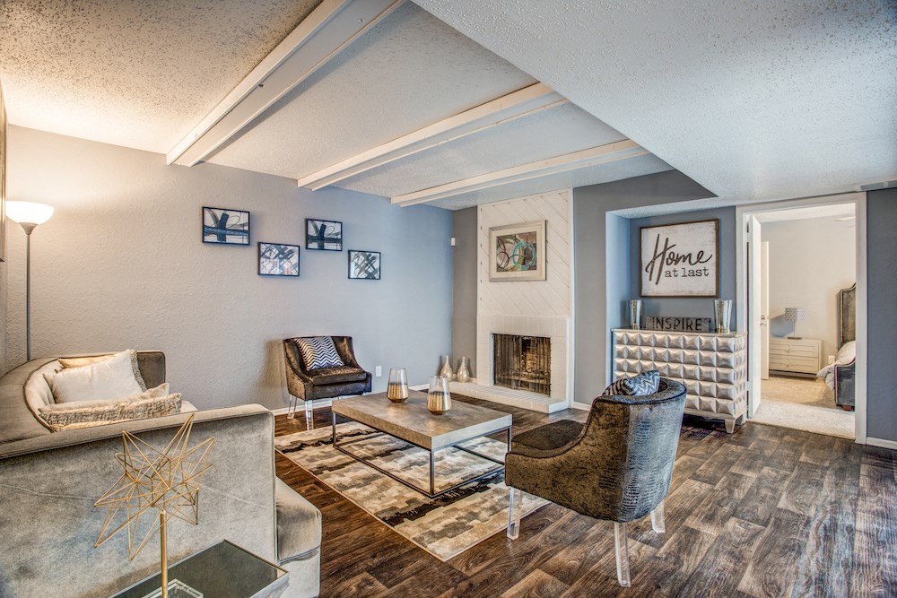 a living room with a fireplace and blue walls