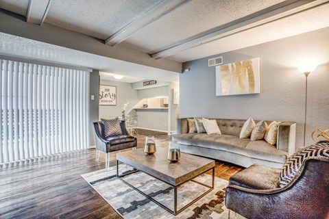 a living room with a couch coffee table and chairs