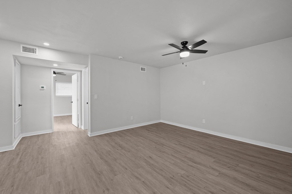Unit image of renovated bedroom with vinyl flooring at Sunset Heights, San Antonio, TX
