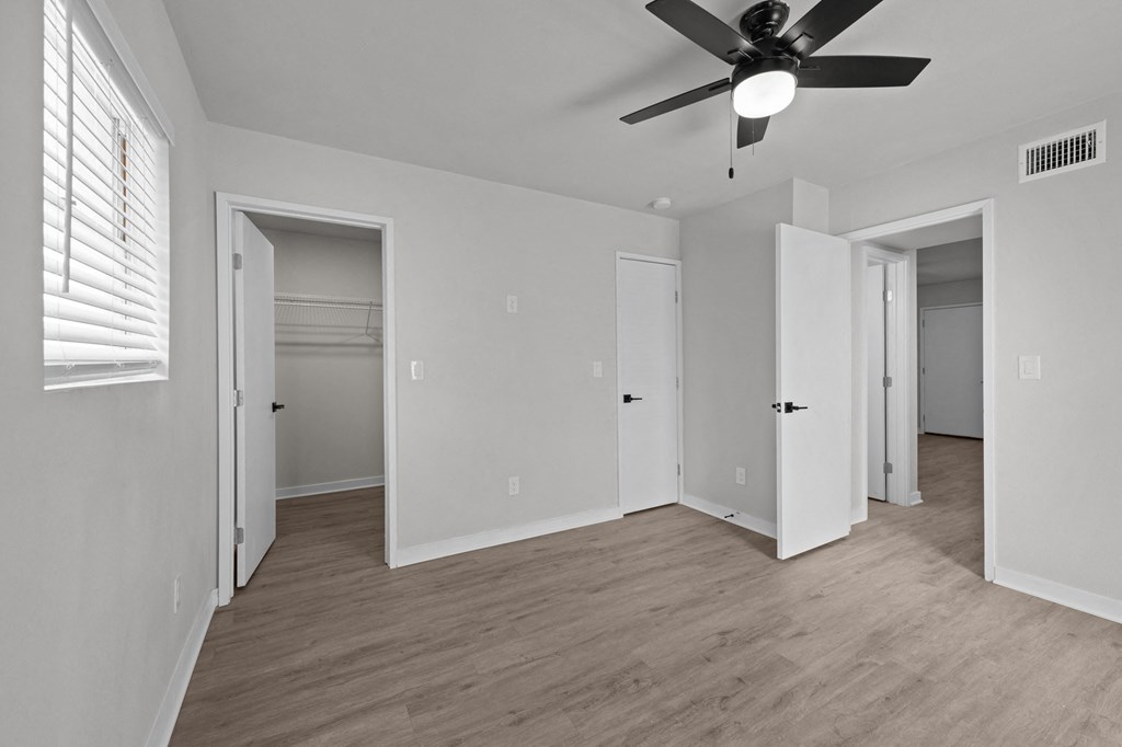the living room of an empty house with a ceiling fan at Sunset Heights, Texas, 78209