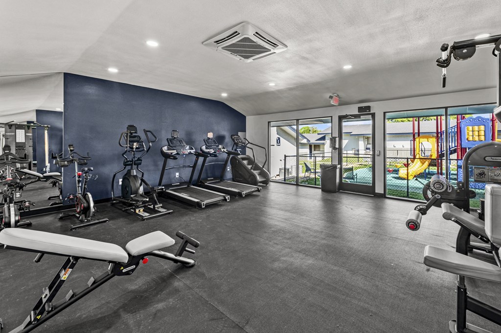 a gym with exercise equipment at Peaks at Live Oak in San Antonio, TX