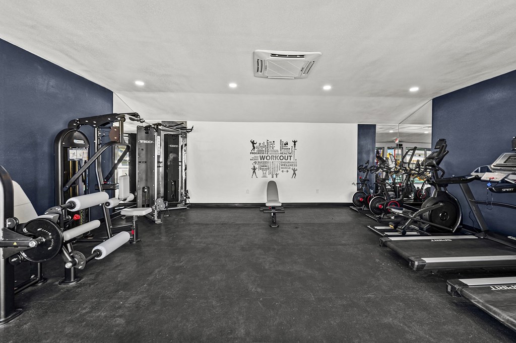 a gym with exercise equipment at Peaks at Live Oak in San Antonio, TX