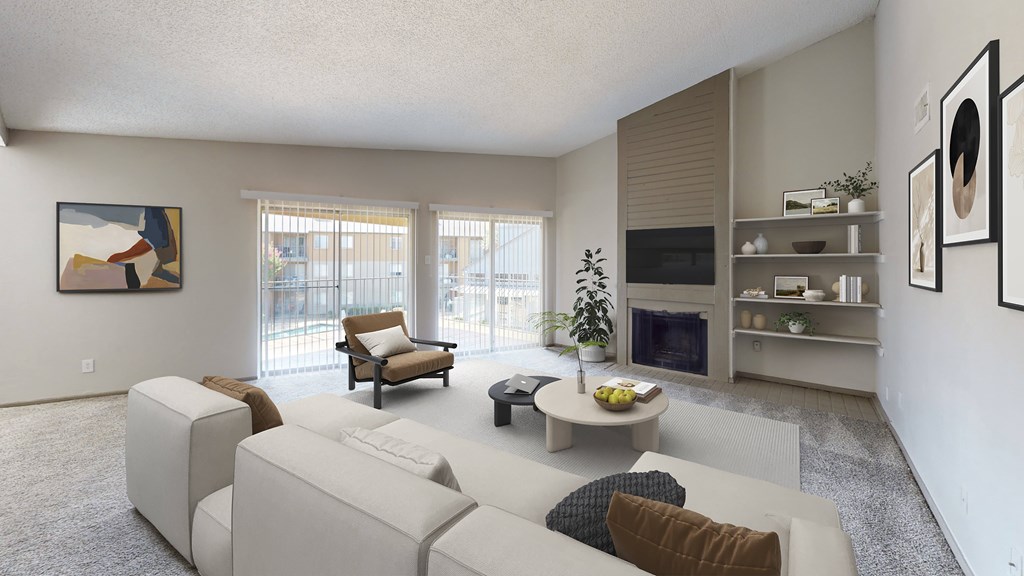 A living room with a white couch and a television.