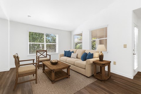 A living room with a couch, chair, and coffee table.