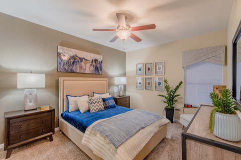 Bedroom with ceiling fan and neutral decor at Country Club Apartments, Mesquite, TX 75150