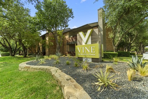 a view of the vine entrance sign in front of a building