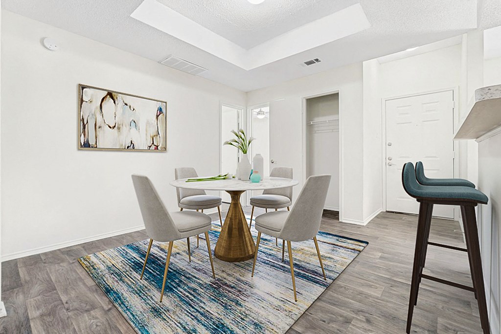 our apartments offer a dining room with a table and chairs