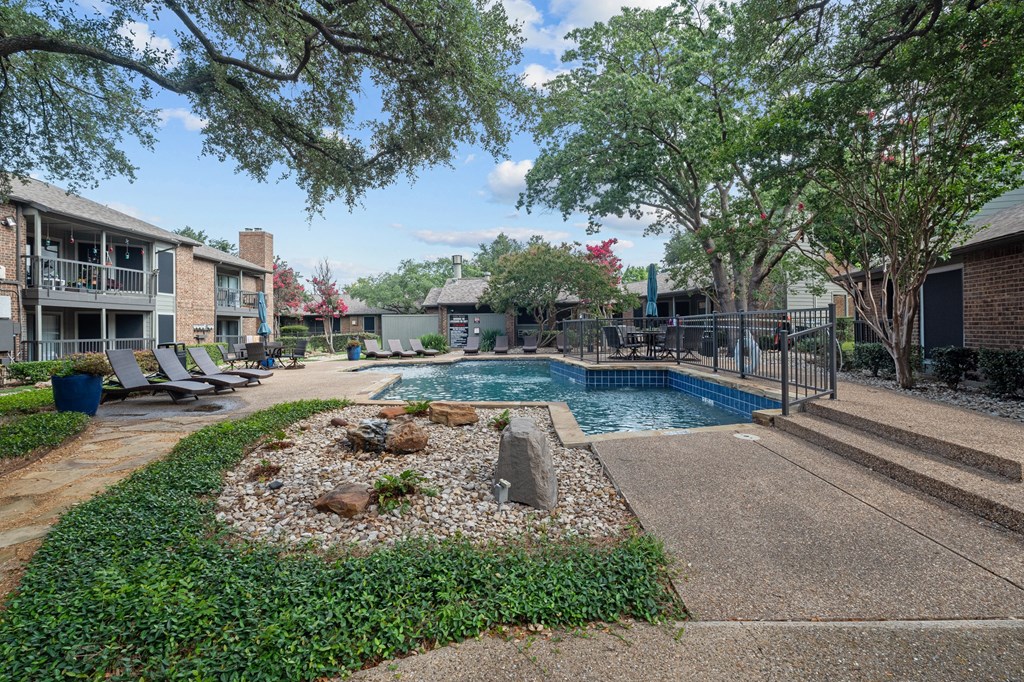 take a dip in the resort style pool at legacy apartments in plano, tx